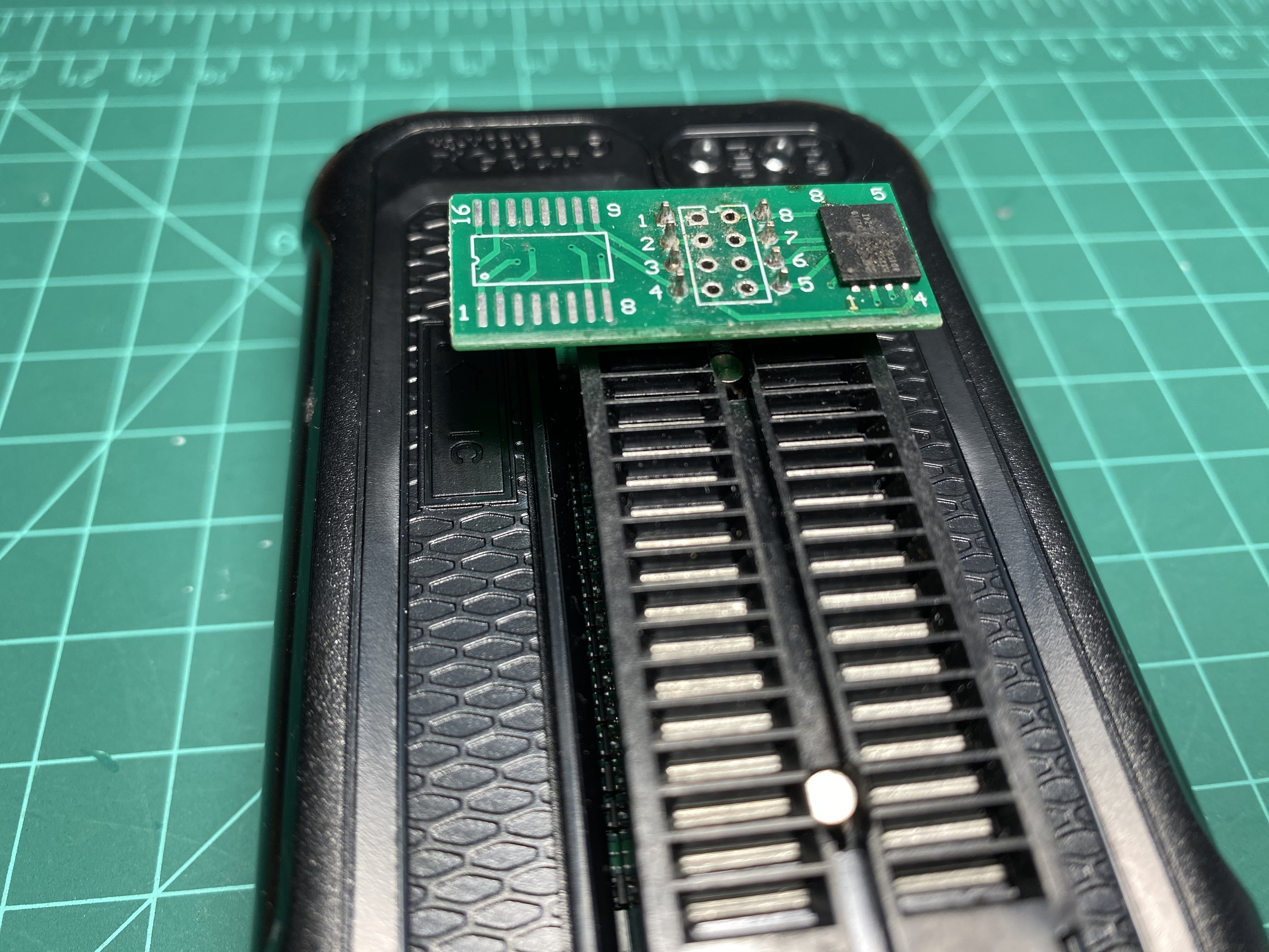 Flash chip on breakout board plugged into a T48 flash reader
